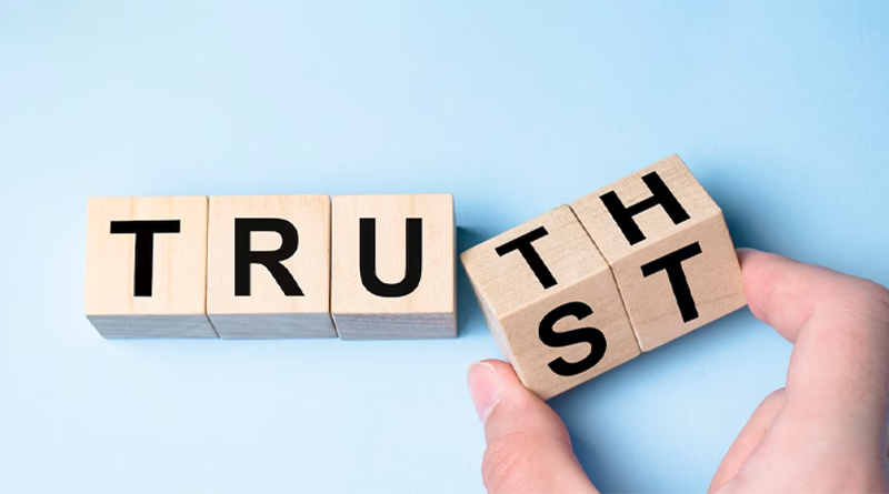  a wooden block with the words "TRUE" and "ST" on it. The block is being turned, and the word "TRUE" is slowly changing to the word "TRUST". This image represents the idea that truth can be turned into trust, or vice versa :SwilERP